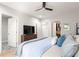 Bedroom featuring ensuite, ceiling fan, and hardwood floors at 1481 Almont Sw Dr, Atlanta, GA 30310