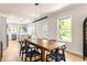 Bright dining room featuring wood floors and a view of the backyard at 1481 Almont Sw Dr, Atlanta, GA 30310