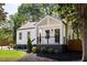 Charming home featuring a covered front porch, manicured landscaping and a newly painted exterior at 1481 Almont Sw Dr, Atlanta, GA 30310