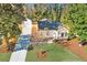 Charming home features a new driveway and an eye-catching yard with mature trees for relaxing afternoons at 1481 Almont Sw Dr, Atlanta, GA 30310