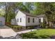 Charming renovated home with a well-manicured front lawn and landscaped flower beds at 1481 Almont Sw Dr, Atlanta, GA 30310