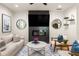 Bright living room featuring modern decor, fireplace, and large windows at 1481 Almont Sw Dr, Atlanta, GA 30310
