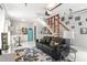 Charming living area features a retro-style fridge and an open staircase to the upper level at 1481 Almont Sw Dr, Atlanta, GA 30310