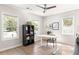 Bright home office with hardwood floors, windows, and a modern desk setup at 1481 Almont Sw Dr, Atlanta, GA 30310