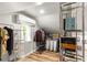 Walk-in closet with shelving, clothes rack, air conditioning unit, and hardwood floors at 1481 Almont Sw Dr, Atlanta, GA 30310