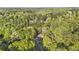 Overhead view of home and surrounding wooded neighborhood in a serene setting at 1488 Rivermist Sw Dr, Lilburn, GA 30047