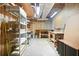 Unfinished basement area with shelving and exposed ceiling, as well as work benches at 1488 Rivermist Sw Dr, Lilburn, GA 30047