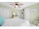 Cozy bedroom with a ceiling fan, neutral decor, and ample closet space at 1488 Rivermist Sw Dr, Lilburn, GA 30047