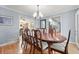 Dining room with wood floors and large table set for dinner at 1488 Rivermist Sw Dr, Lilburn, GA 30047