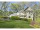 Charming two-story home with well-manicured lawn and lush landscaping at 1488 Rivermist Sw Dr, Lilburn, GA 30047