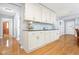 Well-appointed kitchen with white cabinetry and hardwood flooring at 1488 Rivermist Sw Dr, Lilburn, GA 30047