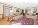Spacious living room with hardwood floors, fireplace, and comfortable seating at 1488 Rivermist Sw Dr, Lilburn, GA 30047