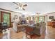 Bright and airy living room with hardwood floors and a fireplace at 1488 Rivermist Sw Dr, Lilburn, GA 30047