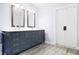 Stylish main bathroom with a double vanity, sleek mirrors, and contemporary finishes for a spa-like experience at 1488 Rivermist Sw Dr, Lilburn, GA 30047