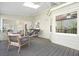 Relaxing covered porch with comfortable seating, a porch swing, and a ceiling fan at 1488 Rivermist Sw Dr, Lilburn, GA 30047