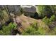 Aerial view of a house with a yard, patio, and bordered by mature trees that provide great privacy at 158 Grove Meadow Dr, Acworth, GA 30101