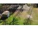 Aerial view of the backyard with a storage building and mature trees offering shade at 158 Grove Meadow Dr, Acworth, GA 30101
