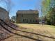 Large grassy backyard and exterior view of the home at 158 Grove Meadow Dr, Acworth, GA 30101