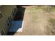 Expansive backyard with a concrete patio and lush greenery, providing a serene and private outdoor space at 158 Grove Meadow Dr, Acworth, GA 30101
