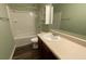 Bathroom featuring a sink vanity, a shower, and a medicine cabinet, ensuring comfort and convenience at 158 Grove Meadow Dr, Acworth, GA 30101