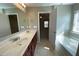 Well-lit bathroom featuring a double sink vanity and soaking tub at 158 Grove Meadow Dr, Acworth, GA 30101
