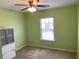 Bedroom with storage cabinet, window, and ceiling fan at 158 Grove Meadow Dr, Acworth, GA 30101