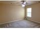 Bedroom with a ceiling fan and natural light from the window, creating a cozy atmosphere at 158 Grove Meadow Dr, Acworth, GA 30101