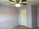 Comfortable bedroom featuring a ceiling fan and a white door at 158 Grove Meadow Dr, Acworth, GA 30101