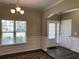 Light-filled dining room with decorative wall trim and a view of the front yard at 158 Grove Meadow Dr, Acworth, GA 30101