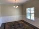 Dining room featuring decorative wall trim and a large window that provides natural light at 158 Grove Meadow Dr, Acworth, GA 30101