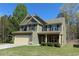 Inviting two-story home showcasing manicured landscaping and a classic facade at 158 Grove Meadow Dr, Acworth, GA 30101