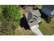 Aerial view of a charming two-story home with a well-maintained yard and a paved driveway leading to the attached garage at 158 Grove Meadow Dr, Acworth, GA 30101