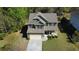 Aerial view of a beautiful two-story home with manicured lawn at 158 Grove Meadow Dr, Acworth, GA 30101
