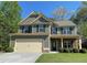 Attractive two-story home with a well-maintained lawn, showcasing its charming curb appeal at 158 Grove Meadow Dr, Acworth, GA 30101