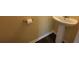 Clean half bathroom with a pedestal sink and crisp white fixtures at 158 Grove Meadow Dr, Acworth, GA 30101
