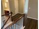 Hallway with hardwood floors leading to bathroom and bedrooms in the home at 158 Grove Meadow Dr, Acworth, GA 30101