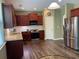 Well-equipped kitchen with granite countertops, stainless steel appliances and wood floors at 158 Grove Meadow Dr, Acworth, GA 30101