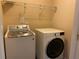 Functional laundry room with modern washer and dryer units at 158 Grove Meadow Dr, Acworth, GA 30101