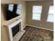 Bright living room showcases a fireplace and large windows that provide ample sunlight at 158 Grove Meadow Dr, Acworth, GA 30101