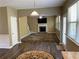 Open living room floor plan with stone fireplace, large windows, and access to the kitchen at 158 Grove Meadow Dr, Acworth, GA 30101