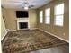 Cozy living room with a stone fireplace, mounted television, and large windows at 158 Grove Meadow Dr, Acworth, GA 30101