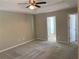 Spacious main bedroom with a trey ceiling, carpet, and en-suite bathroom access at 158 Grove Meadow Dr, Acworth, GA 30101