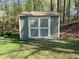 Backyard shed for extra storage with double doors at 158 Grove Meadow Dr, Acworth, GA 30101