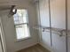 This walk-in closet offers plenty of storage with adjustable shelving at 158 Grove Meadow Dr, Acworth, GA 30101