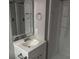 Bathroom featuring a vanity with a mirror, alongside a shower and tub combination at 2858 Davidson Dr, Lithonia, GA 30058