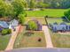 Beautiful aerial view of a single Gathering home with mature trees and well-maintained lawn in neighborhood at 31 Churchill Downs Ne, Cartersville, GA 30121