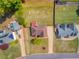 Aerial view of the house showcasing its layout, surrounding greenery, and expansive backyard at 31 Churchill Downs Ne, Cartersville, GA 30121