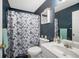 Bathroom featuring a single vanity, toilet, and shower with a floral curtain at 31 Churchill Downs Ne, Cartersville, GA 30121