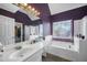 Bathroom with a soaking tub, shower, bright vanity and large mirror at 31 Churchill Downs Ne, Cartersville, GA 30121