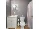 This is a bathroom featuring a single sink vanity and a toilet with shower curtain at 31 Churchill Downs Ne, Cartersville, GA 30121